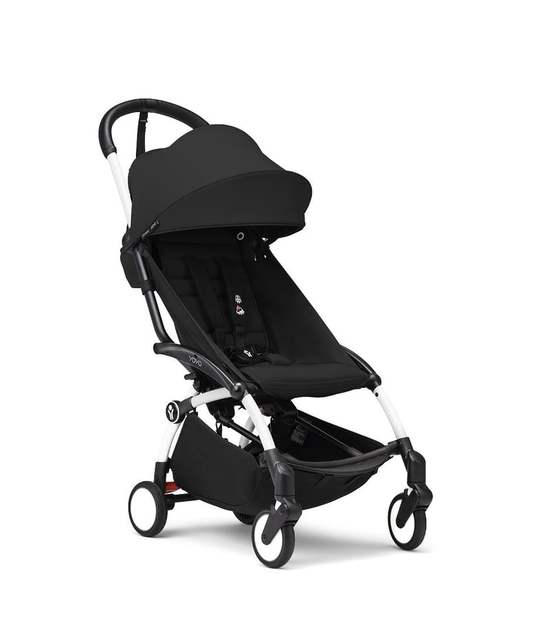 Stokke YOYO3 stroller with White frame and 6+ color pack in Black, angled studio view