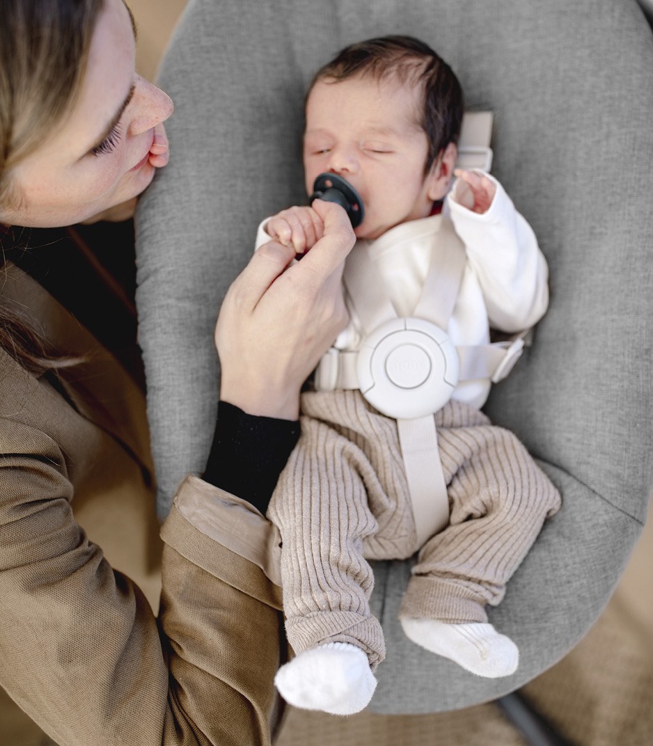 Feeding a baby reclined in the Nomi Newborn Set