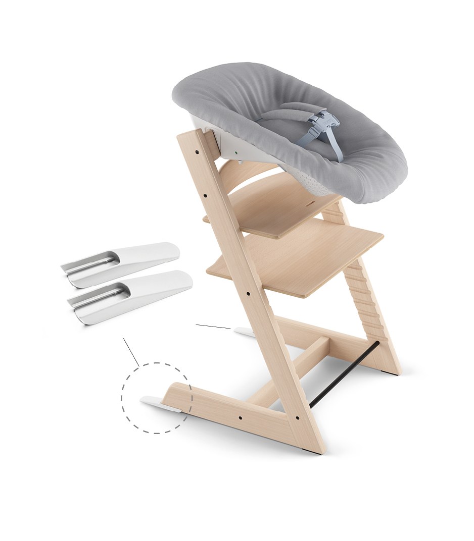 The two extended gliders shown next to the back of the Tripp Trapp Chair base where they clip on